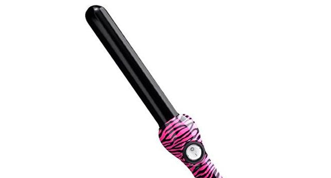 Jose Eber 19 Mm Pink Zebra Clipless Curling Iron with a ceramic-coated barrel, featuring a pink flower print design. The curling iron is shown alongside its packaging with the brand name and a model.